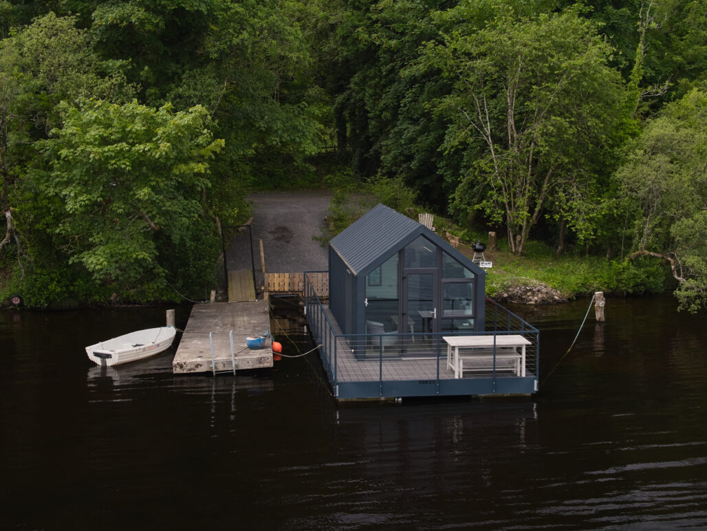 C250 houseboat on a lake in Fermanagh with pontoon and boat