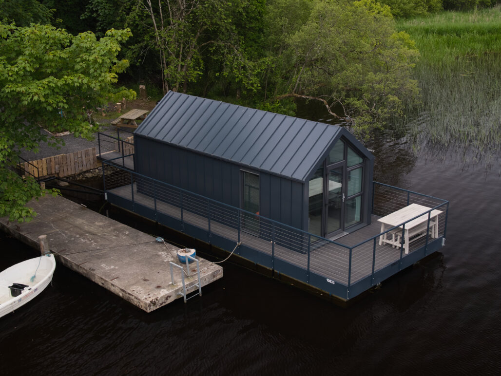 C250 houseboat on a lake in Fermanagh with pontoon and boat