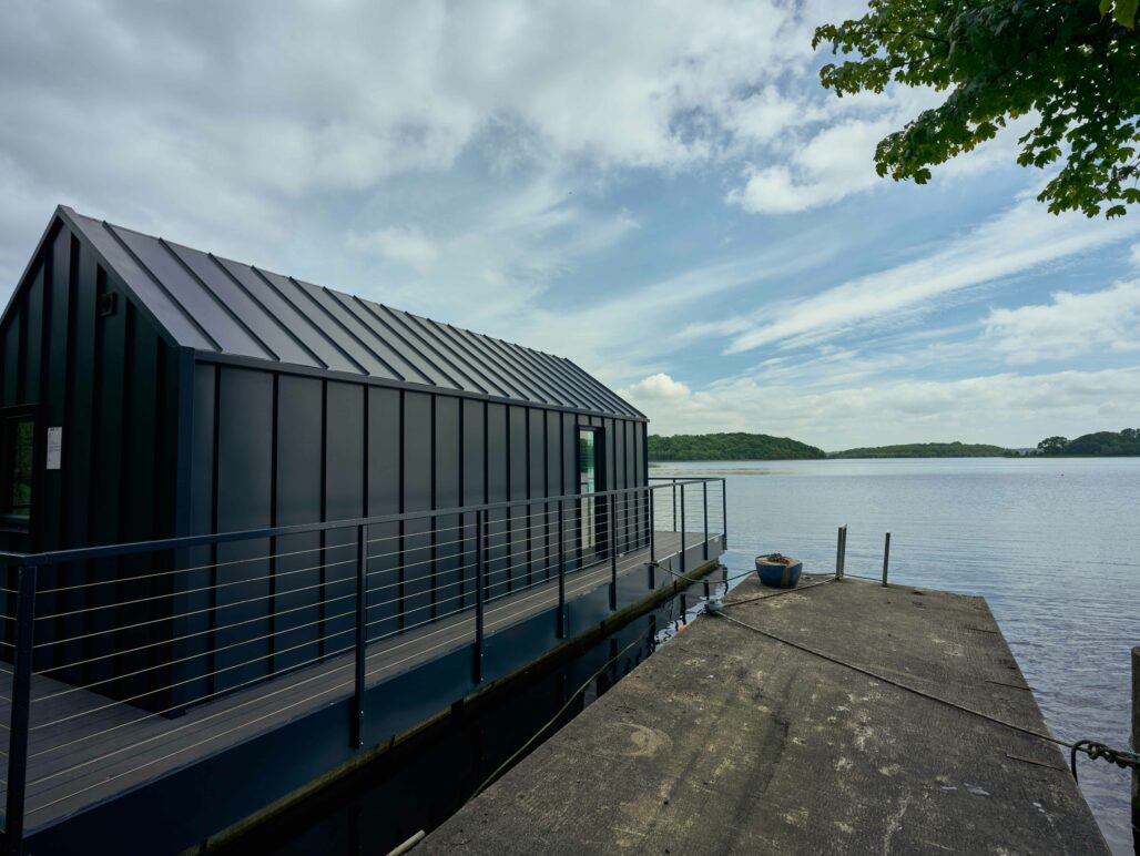 Side view of C250 houseboat on lough Erne Fermanagh with pontoon in foreground
