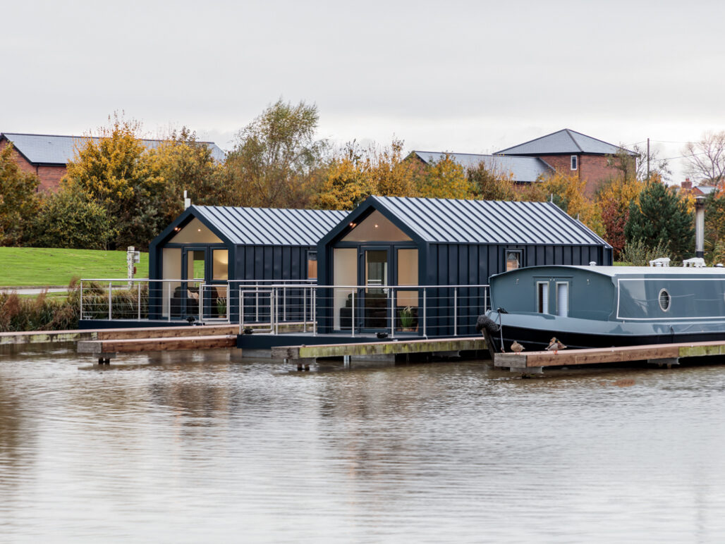 2 x C250 houseboats side by side in the marina with a narrowboat to the right